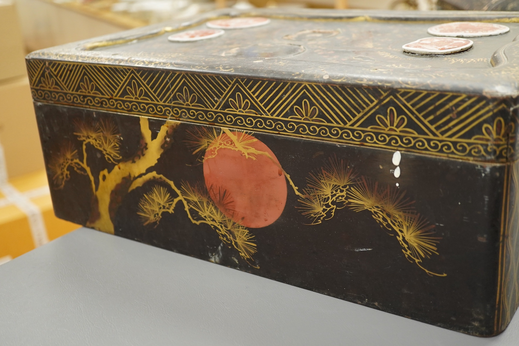 A 19th century Chinese export lacquer box containing assorted mother-of-pearl gaming counters and a 19th century Japanese lacquer box, largest 42.5cm wide. Condition - fair